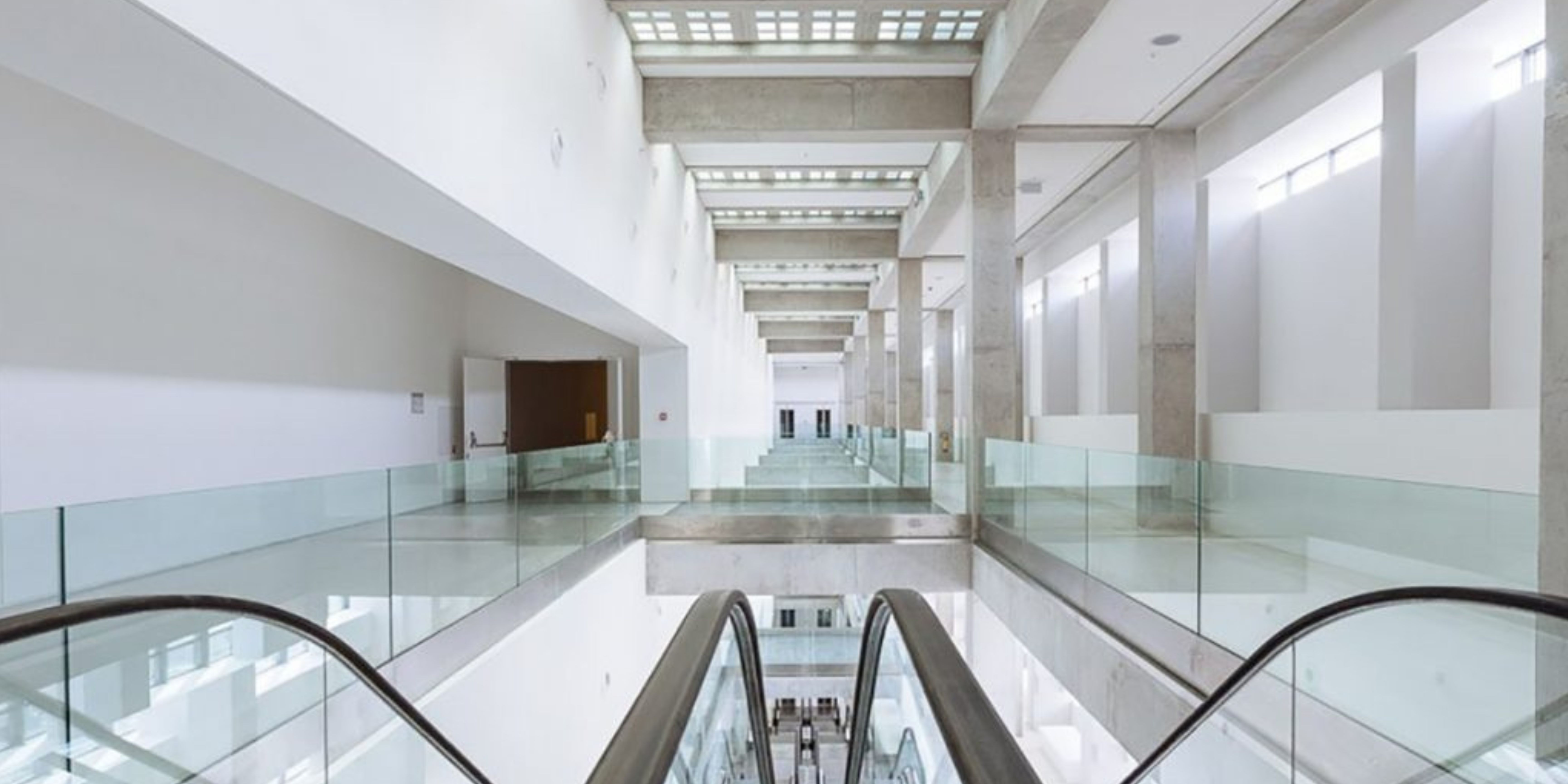 Modern interior of the National Museum of Contemporary Art in Athens, viewed from an escalator.